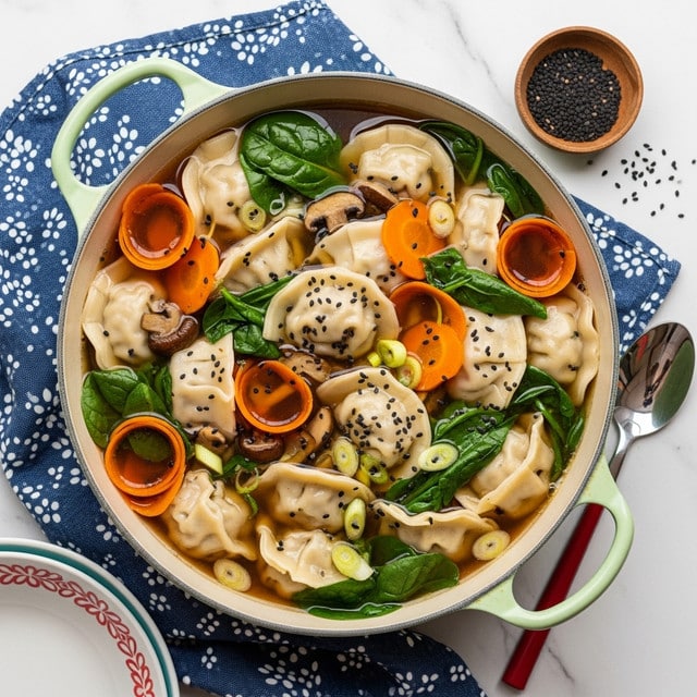 The image shows a white pot with light green handles filled with a soup containing several layers of ingredients. The base layer is a clear, brown broth, floating on top are many filled dumplings that are light beige with a soft, smooth texture. Mixed in with the dumplings are dark green spinach leaves and thin, curly strips of bright orange carrot. Scattered throughout the soup are pieces of brown mushrooms and small slices of light green spring onions. Black sesame seeds are sprinkled over the entire dish, adding contrast to the colors. The pot is placed on a blue cloth with white patterns, and the background is a white marbled surface. Nearby, there is a small wooden bowl with black sesame seeds and a white plate with a red pattern. A spoon with a red handle rests on a blue bowl just outside the pot’s edge. Photo taken with an iphone --ar 4:5 --v 7