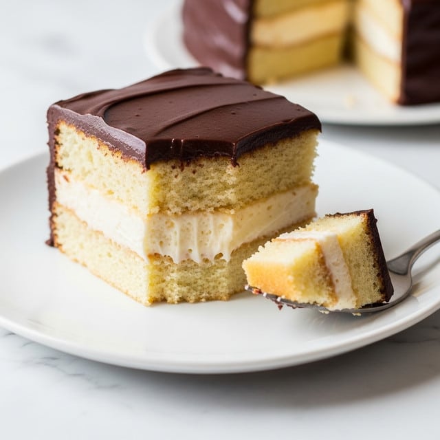 A close-up image of a square cake slice on a white plate, set on a white marbled surface. The cake has three clear layers: the bottom layer is a soft, light yellow sponge with a crumbly texture; the middle layer is creamy and smooth with a pale off-white color, slightly melting into the sponge; the top layer is a thick, glossy, dark chocolate ganache that is evenly spread and shiny. To the right of the cake slice, there is a fork holding a small piece of the cake showing all three layers. Photo taken with an iphone --ar 4:5 --v 7