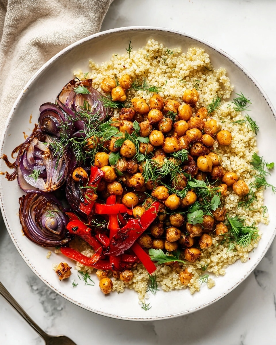 A white speckled plate holds a layered dish starting with a base of light yellow fluffy quinoa. On top of the quinoa, there are roasted bright red pepper strips with a shiny glaze, scattered around smoky caramelized purple onion slices that show charred edges. The top layer is made of golden-brown chickpeas mixed with fresh green herbs like dill and parsley, adding a pop of vibrant green color across the dish. The plate sits on a matching white speckled dish against a white marbled background with a beige cloth nearby. Photo taken with an iphone --ar 4:5 --v 7